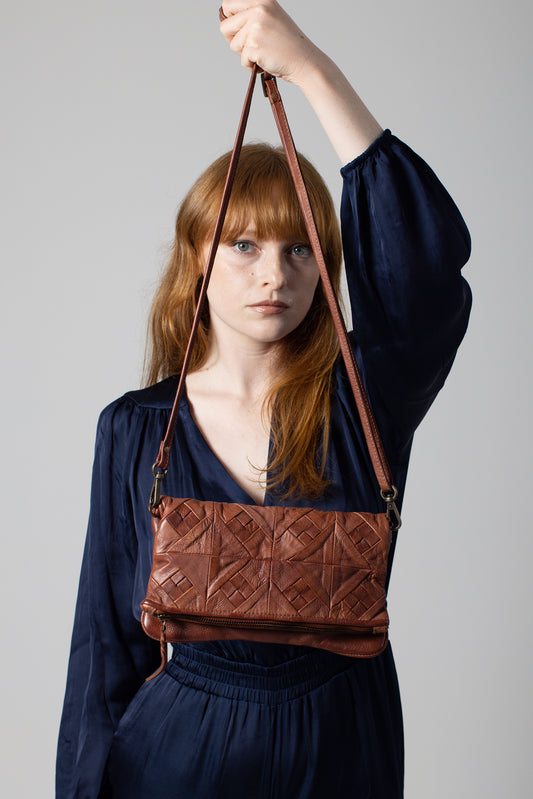 Tan leather clutch bag
Classic leather clutch
Women’s leather clutch
Handmade leather clutch
Minimalist leather bag
Small leather clutch
Evening leather clutch
Tan leather evening bag
Leather clutch with gold accents
Vintage tan leather clutch
Tan leather purse
Luxury leather clutch