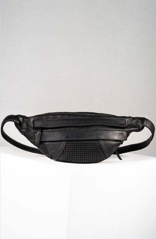 Black leather waist bag on a light gray background
